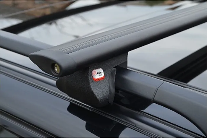 Багажник на интегрированные рейлинги Amos Alfa для Hyundai Tucson III 2015-2020 (Aero-Alfa дуги с замком черные)